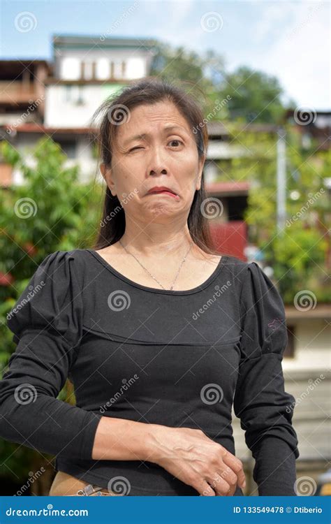 Retired Filipina Female Senior Winking Stock Photo Image Of Asian