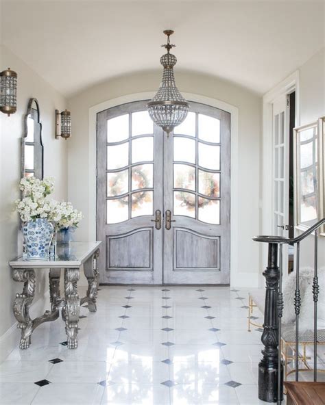 French Double Doors In A French Country Home Entryway Design With White