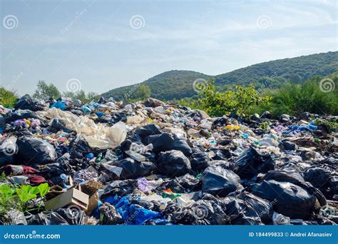 Garbage Dump On A Background Of Mountains Environmental Pollution