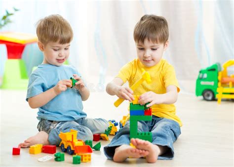 Kids Playing Toys In Playroom At Nursery Stock Photo Image Of Block
