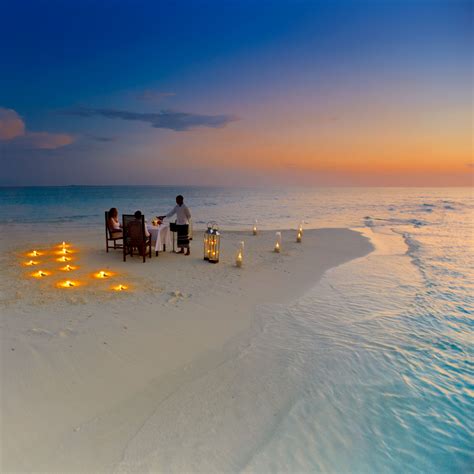 experience a private romantic dinner on our castaway sandbank at baros maldives maldives luxury