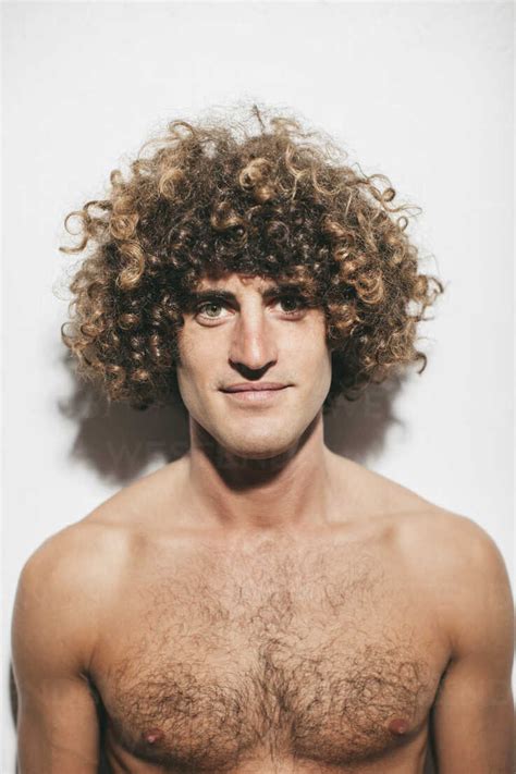 Portrait Of Naked Man With Curly Hair Stock Photo