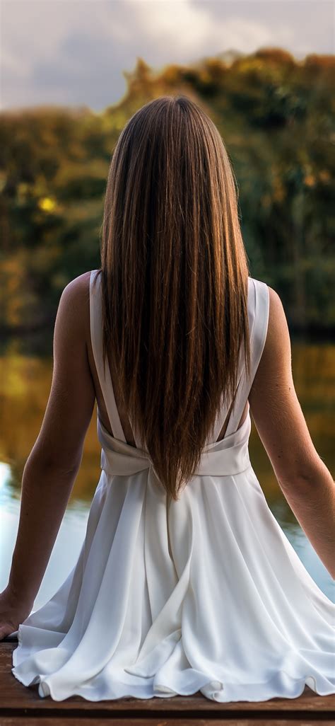 1125x2436 Girl Sitting On Pier Back View 5k Iphone Xsiphone 10iphone