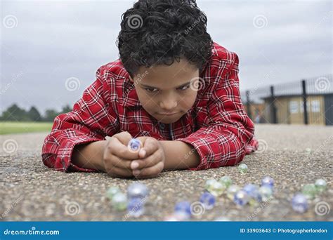 Boy Playing Marbles On Playground Stock Image Image Of Enjoyment