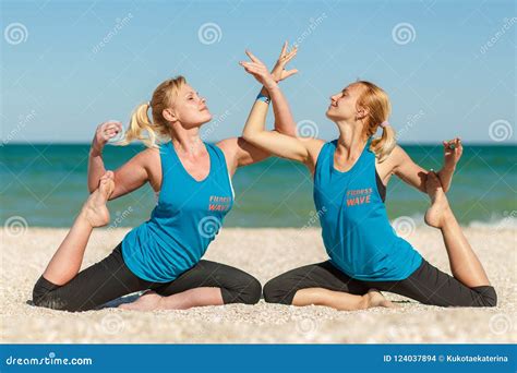 Two Womans Doing Yoga Fitness Exercises On The Sea Beach Editorial Stock Image Image Of Health