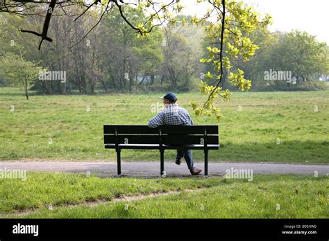 Man Sitting Alone On Park Bench Stock Photo 17531724 Alamy