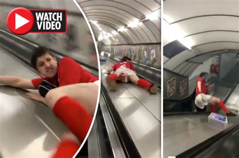 London Underground Drunk Darts Fan Slides Down Escalator In Funny Vid
