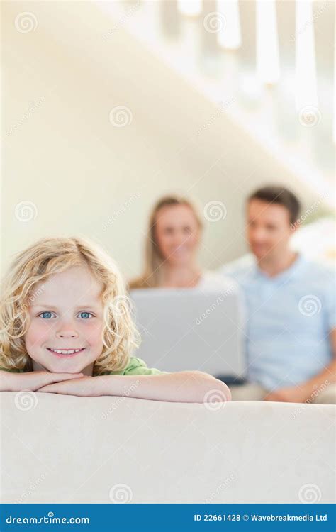 Happy Boy With Parents In The Background Stock Photo Image Of Leisure
