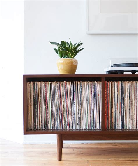 I've been researching vinyl storage (i refuse to have them organized spines out) and this is exactly what i'm wanting to build. Simple record storage solutions for the modern home ...