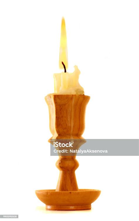 Burning Old Candle Vintage Wooden Candlestick Isolated On White