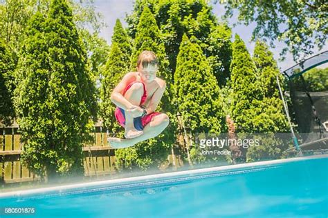 Boy Jump Swimming Pool Photos And Premium High Res Pictures Getty Images