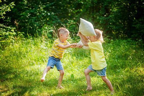 Children Fighting Together With Pillows Stock Photo Image Of Pillow