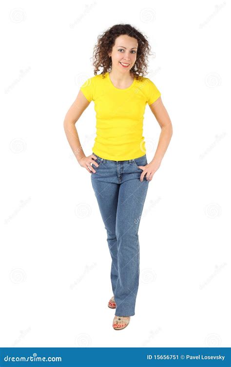 Woman In Yellow Shirt And Jeans Standing Stock Image Image