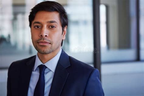 Corporate Confidence Cropped Portrait Of A Businessman Standing In His