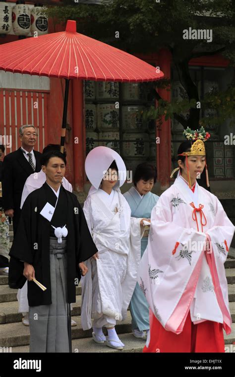 the procession of a traditional japanese shinto wedding ceremony in yasaka jinja shrine kyoto