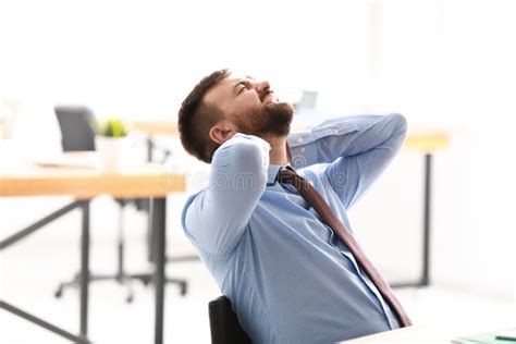 Businessman Suffering From Neck Pain In Office Stock Image Image Of