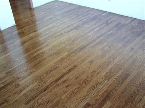 Real hardwood floors need a lot of upkeep and maintenance. Minwax early American stain on Heritage number one Red Oak with Satin finish oil based Poly ...
