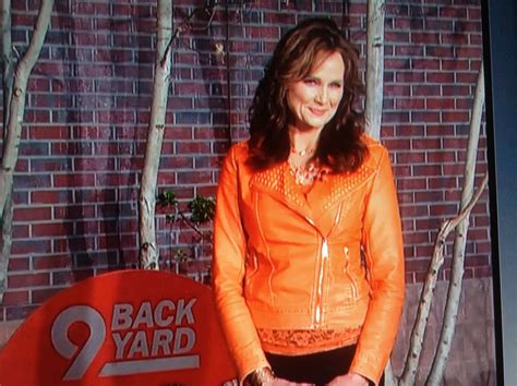 Kathy Sabine 9News wearing Cinderella Ranch Boutique orange leather