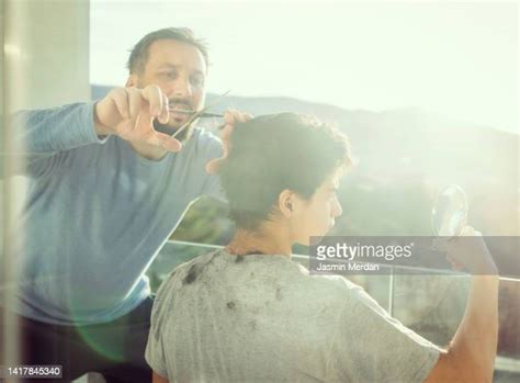 Father And Son Haircut Photos And Premium High Res Pictures Getty Images