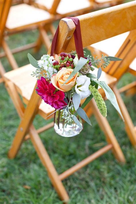 If you envision an outdoor wedding but still want cover in case of rain, there's nothing better than a tent. Burgundy and Peach Aisle Decorations