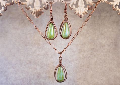 Turquoise Teardrops With A Mossy Picasso Finish Wire Wrapped In Antique