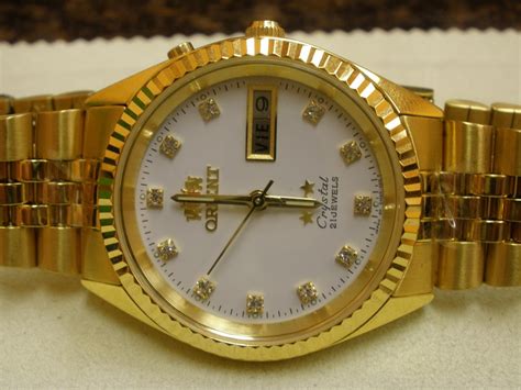 Gold is one of the rarest of elements found on earth. MENS GOLD PLATED ROLEX STYLE ORIENT WATCH
