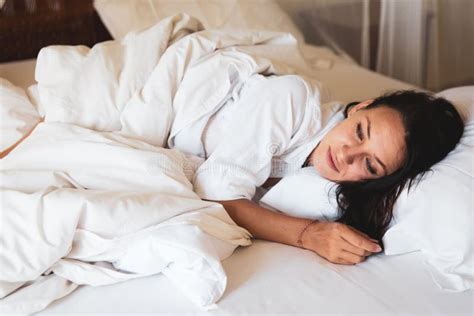 Beautiful Woman Sleeping In White Bed In The Morning Stock Photo