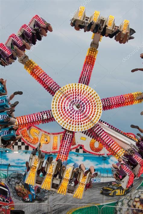 teens enjoy an upside down carnival ride stock editorial photo