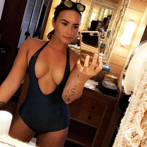 Demi Lovato Shows Off Her Cleavage In Plunging Swimsuit Pics Us Weekly