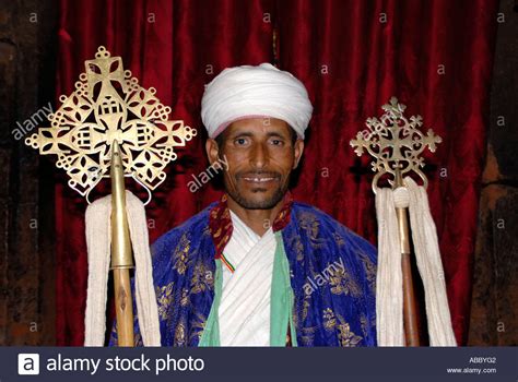 Ethiopian Orthodox Christianity Priest Presents Two Crosses In The Rock