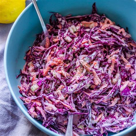 A Blue Bowl Filled With Red Cabbage Salad