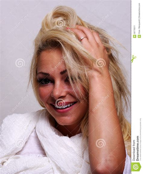 A Smiling Blond Haired Woman Is Looking Into The Camera Stock Image Image Of Pretty