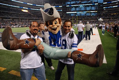 Dallas Cowboys fans with Rowdy on the sidelines before a game at AT&T