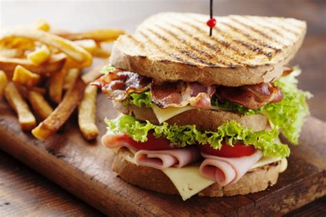 A sandwich is a food typically consisting of vegetables, sliced cheese or meat, placed on or between slices of bread, or more generally any dish wherein bread serves as a container or wrapper for another food type. How To Make A Club Sandwich | MAN'S BLACK BOOK