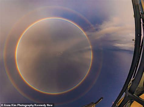 Helicopter Passengers Pass Through A Rare Full Circle Rainbow While