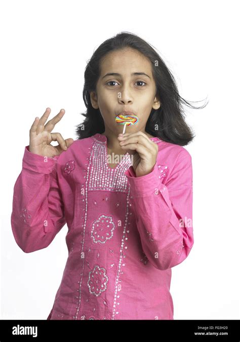 south asian indian girl sucking lollipop en maternelle m photo stock alamy