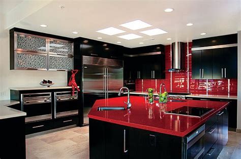 The reflective surface sends light bouncing about the space and works well with gray concrete countertops and flooring. Red Kitchen Design Ideas, Pictures and Inspiration | Black kitchen decor, Red kitchen decor ...