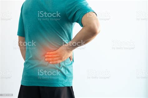 Closeup Man Having Back Pain And Lumbago Stock Photo Download Image