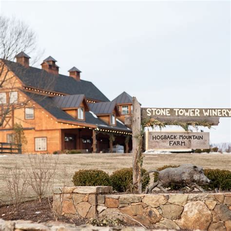Stone Tower Winery Has A Rustic Log Cabin Vibe With Hand Painted Signs