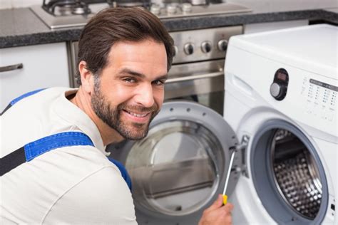 Handyman Fixing A Washing Machine Wheaton Appliance Repair