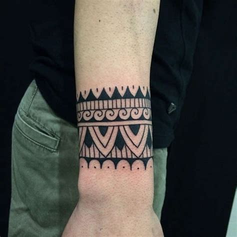 Take a look at our wrist tattoos board to find some inspiration. 29 Solid Wristband Tattoos Designs