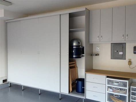 Garage Cabinets Are Made With Sliding Doors Which Saves Space Is