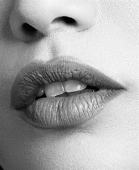 A Womans Lips Are Shown In Black And White
