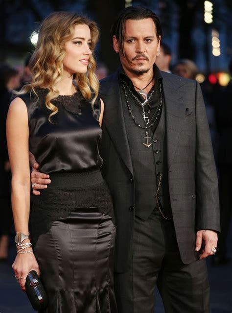 Check spelling or type a new query. Johnny Depp can't keep his hands off MUFFLER as wife Amber ...