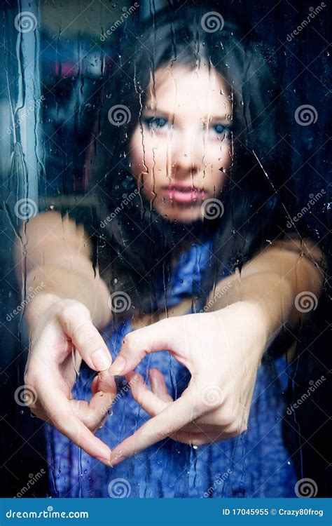 Girl Making Heart From Fingers Behind Wet Window Stock Image Image Of