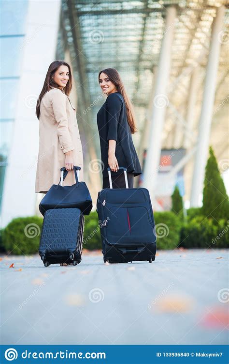 Vacation Two Happy Girls Traveling Abroad Together Carrying Suitcase