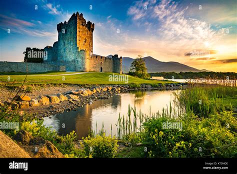 Ancient Old Fortress Ross Castle Ruin With Lake And Grass In Ireland