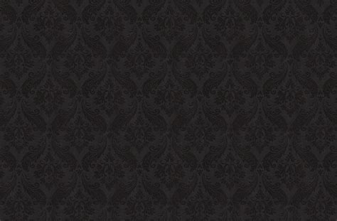 Black Wallpaper With An Ornate Design In The Middle And Dark Colors On