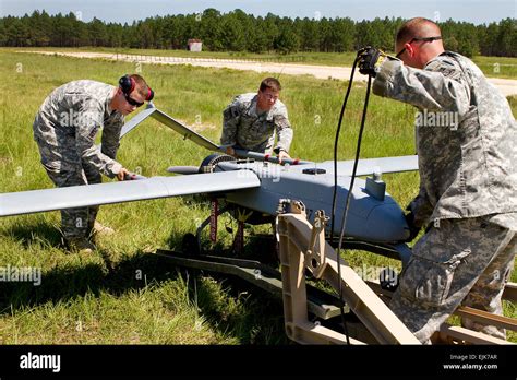 Soldiers Mount A Shadow 200 Unmanned Aerial Vehicle Onto Its Launching