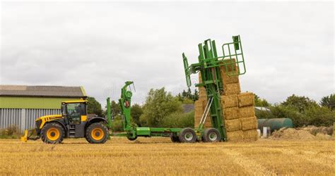 Bale Chaser Stacking Bales Of Straw Into Position In A Field UK